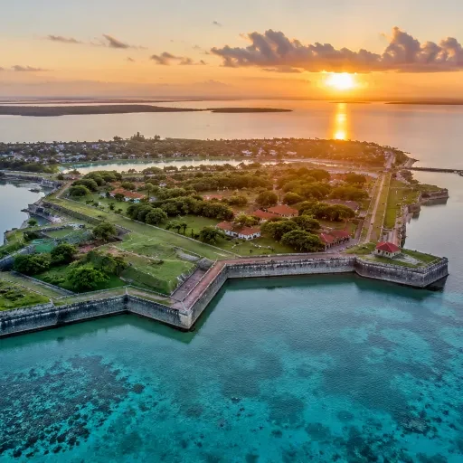 Northern coastal fort ramparts and turquoise water at sunset; supplied travel image