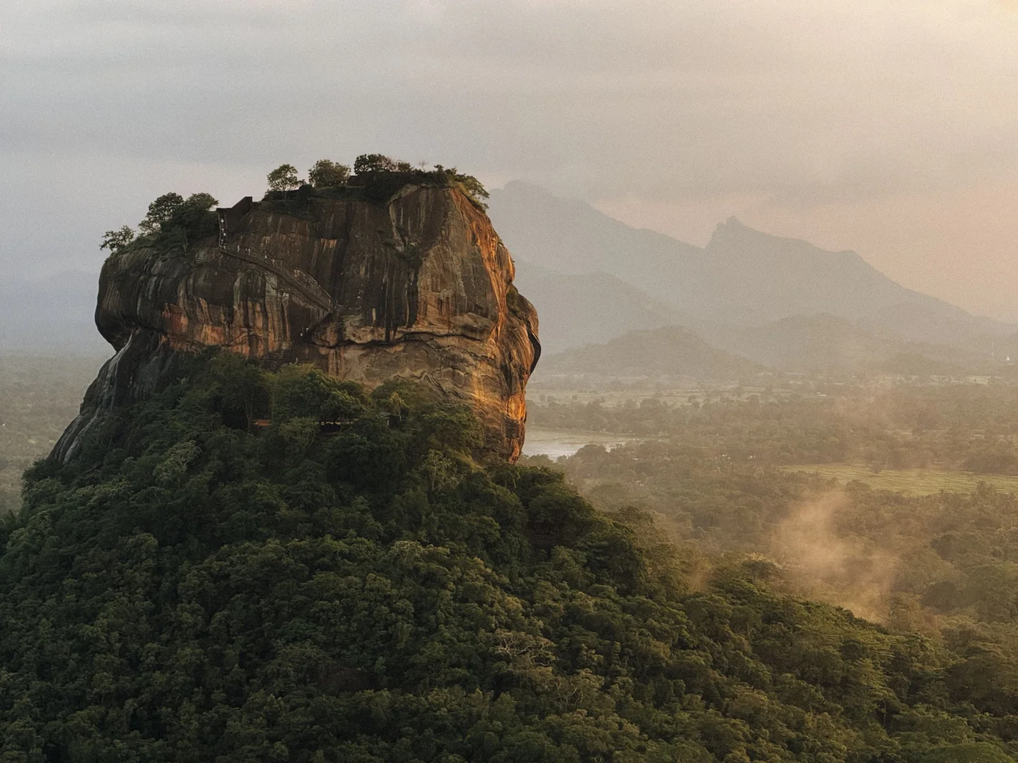 Sigiriya rock rising above the green Sri Lankan landscape